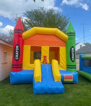 Kids love our bounce house with large crayons. Contact us to Rent!